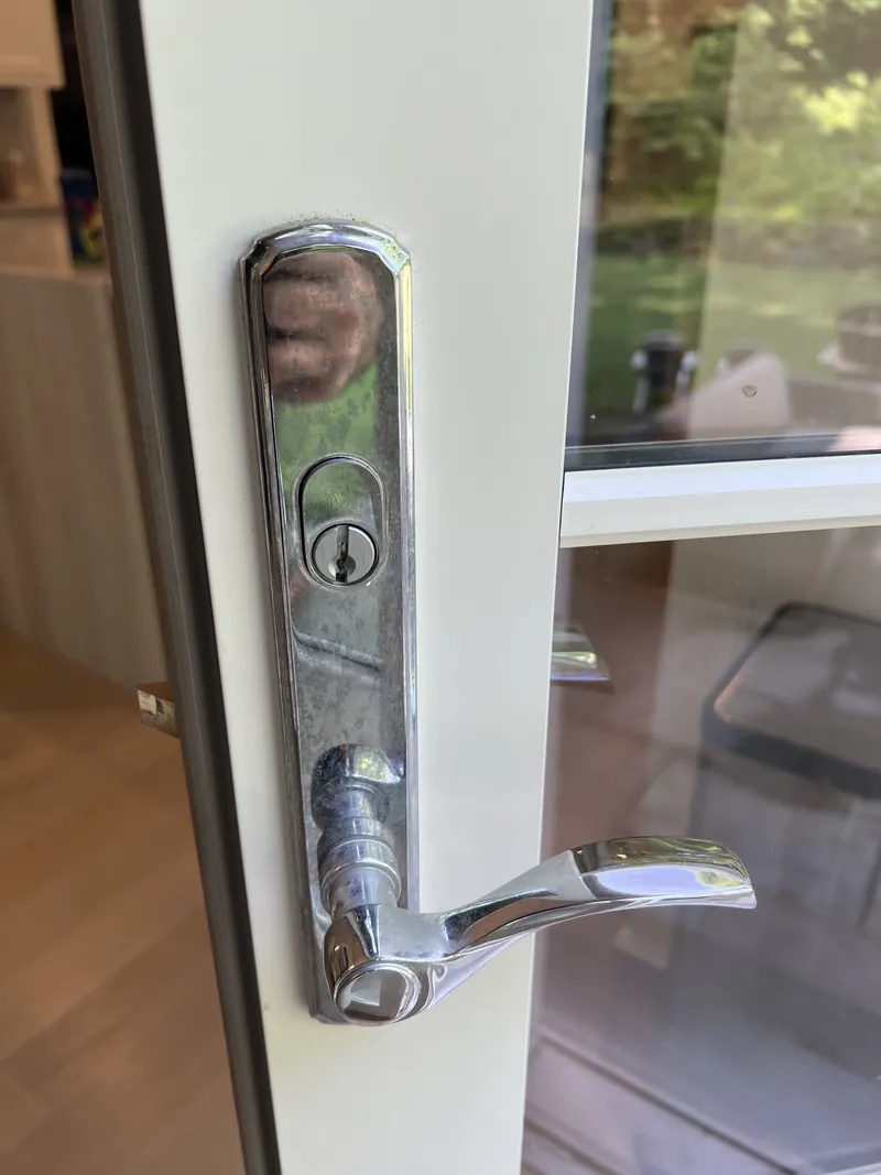 Keyed lever handle trim on the outside of a patio door